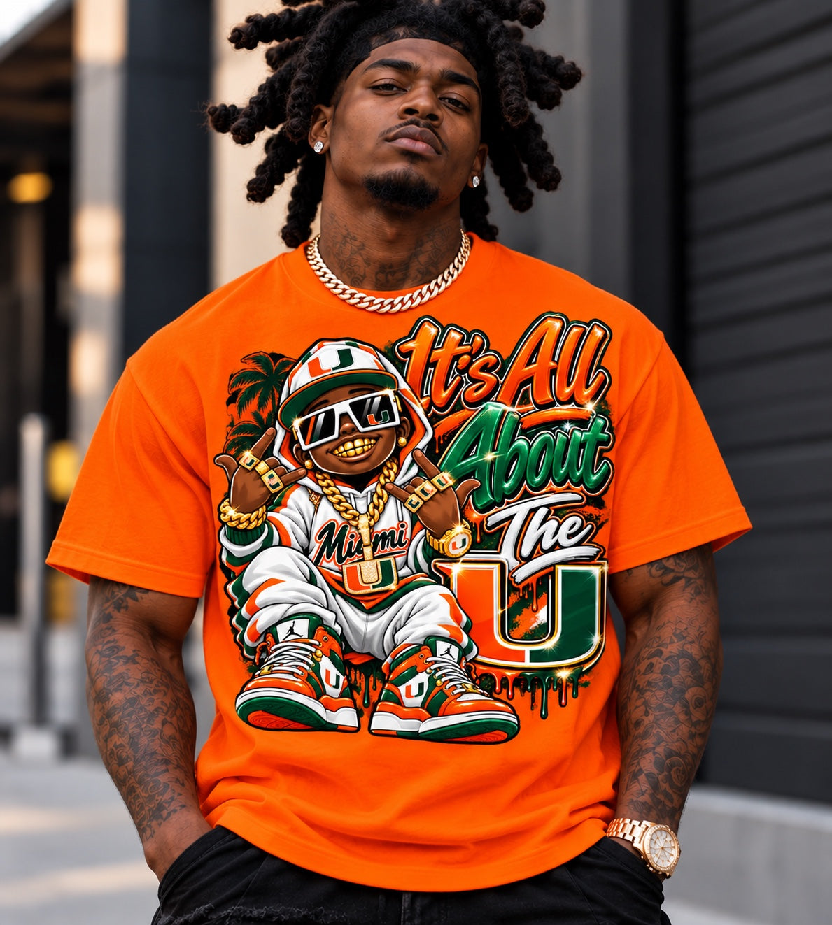 Male model wearing an orange University of Miami It's All About the U graphic T-shirt